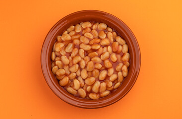 Plate of baked beans in tomato sauce, top view