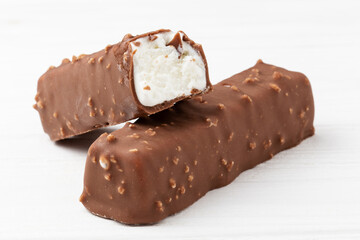 Two chocolate ice cream bars on white background close up macro shot
