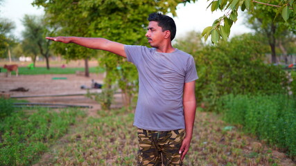 Morning sunrise, Namaste Lotus pose. Meditation and Relax. Indian man doing yoga on world yoga day.