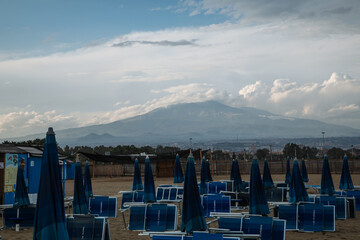 Naklejka premium beach in Catania Sicily with the view of Mount Etna in the distance 