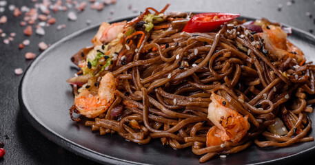 Delicious fresh pasta with tomatoes, shrimp and spices