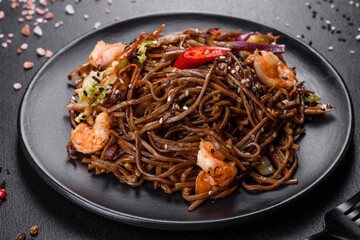 Delicious fresh pasta with tomatoes, shrimp and spices