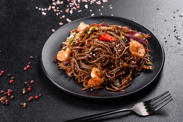 Delicious fresh pasta with tomatoes, shrimp and spices