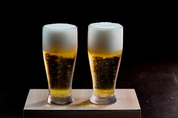 glass of beer isolate on black