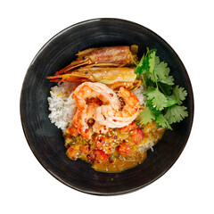 Isolated bowl of asian curry rice with langoustines