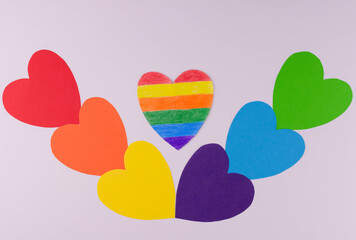 Hearts in the colors of the LGBT community flag on a white background.