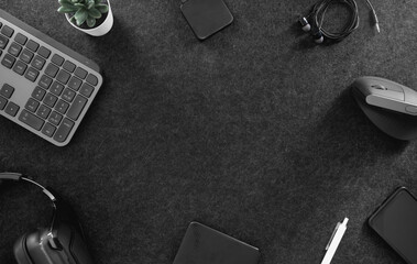 top view of office desk table with keyboard, mouse, smartphone and accessory on table.