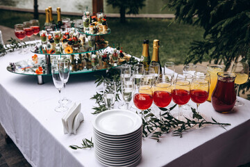Champagne and wine in glasses. Wedding table. Banquet table setting and decoration.