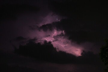 Nature lightning flash in cloudy dark rainy sky