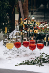 Champagne and wine in glasses. Wedding table. Banquet table setting and decoration.