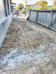 The rebar that are tied with thin wire into squares are laid on the ground before concrete is poured.