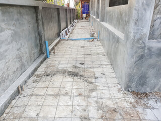 The rebar that are tied with thin wire into squares are laid on the ground before concrete is poured.