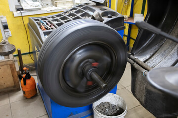 Car wheel repair in a tire workshop.