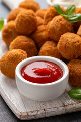 Meat free vegetarian mini picnic scotch eggs with micoprotein and herbs served with ketchup and mayonnaise