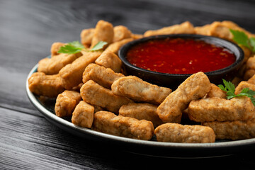 Party finger food southern style chicken breast bites served with sweet chilli sauce