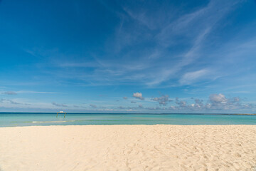 Paradise white sand beach and turquoise water in nice summer day, Gulhi Island, Maldives