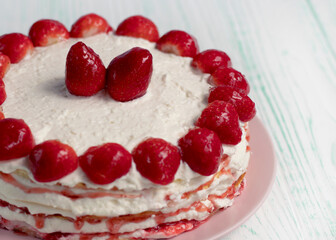 selective focus. Strawberry pie garnished with fresh strawberries. Homemade strawberries cake made from meringue cake and cream with strawberries. Decorated with icing and berries