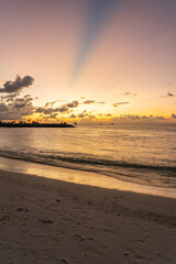 Golden sunset in bikini beach, Maafushi island, Maldives