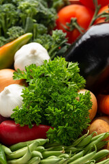 Fresh Vegetables in wooden box on dark wooden background