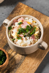 Fried rice with bacon and egg. Asian rice dish. Copy space.