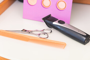 Close-up of hairdressing tools used to cut a client's hair.