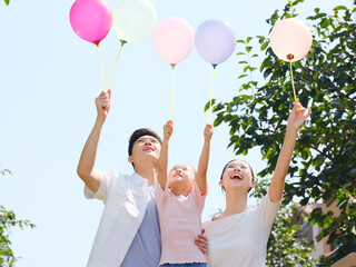 Happy family of three in the outdoor group photo