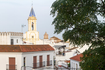 Fototapeta na wymiar Torre de Iglesia en el pueblo de Cartaya, provincia de Huelva, comunidad autonoma de Andalucia o Andalusia, pais de España o Spain