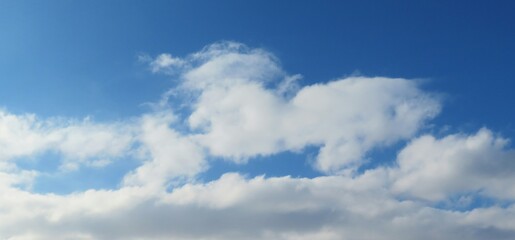 Naklejka na ściany i meble Panoramic view of blue sky with beautiful clouds