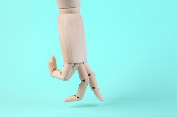 Wooden hand steps with fingers on a blue background