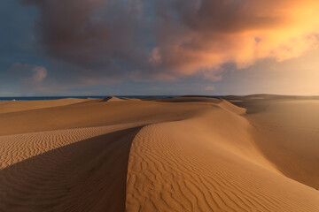 View of Playa del Inglés from the dunes of Maspalomas at sunset.
