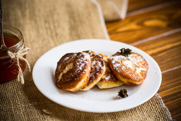 sweet fried cottage cheese pancakes in a plate