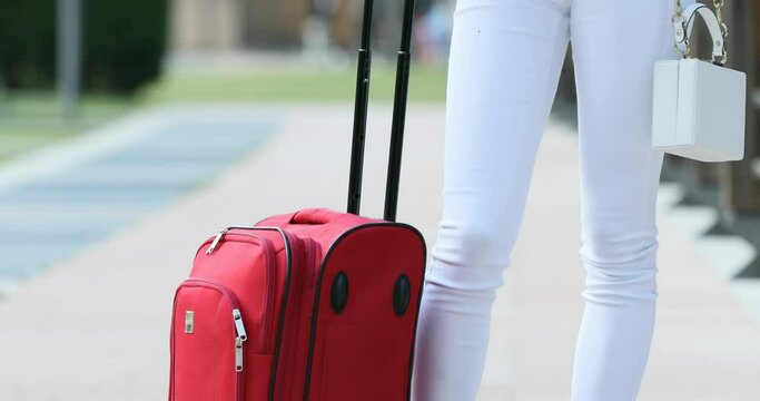 two vertical panoramic shots of girl with a trolley suitcase outdoors