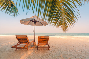 Amazing beach. Chairs on the sandy beach sea. Luxury summer holiday and vacation resort hotel for...
