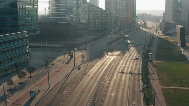 Drone aerial view  of empty business street in the morning. Filmed during quarantine by reason of Covid-19. Constitution Avenue, Vilnius, Lithuania. March 28th 2020