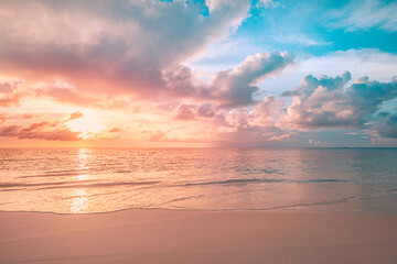 Closeup sea sand beach. Panoramic beach landscape. Inspire tropical beach seascape horizon. Orange and golden sunset sky calmness tranquil relaxing sunlight summer mood. Vacation travel holiday banner