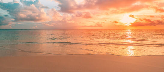 Closeup sea sand beach. Panoramic beach landscape. Inspire tropical beach seascape horizon. Orange and golden sunset sky calmness tranquil relaxing sunlight summer mood. Vacation travel holiday banner - obrazy, fototapety, plakaty