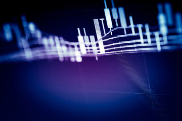 Abstract financial trading graphs and digital number of foreign exchange market trading on monitor. Background of gold and blue digital chart to represent stock market trend.