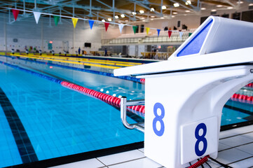 Aligned swimming starting block and platform with number