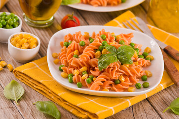 Fusilli pasta with peas and sweet corn.