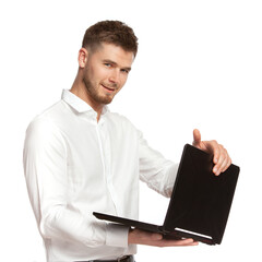 Portrait of a young business man with a laptop in his hands in a white shirt isolated on a white background.