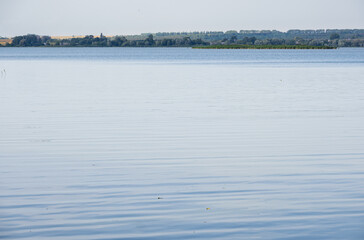 Summer hazy day on picturesque lake