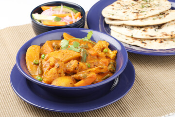 Dinner preparation of various indian food menus Mixed veg curry naan or  roti chapati or Indian Flat bread