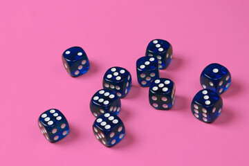 Many dice on pink background