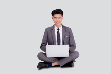 Young asian business man sitting work on laptop computer to internet online isolated on white background, businessman confident and notebook, freelance with success, marketing and communication.
