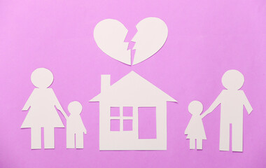 Broken family, divorce. Property division. Split paper family, house, heart on pink background