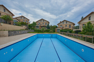 Empty pool in the site, blue ceramic outdoor style.