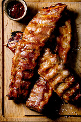Grilled pork ribs on wooden plate