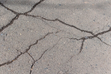 Obraz premium cracks on the asphalt