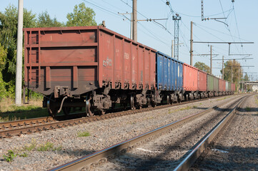 Fototapeta na wymiar The coupling of freight cars standing on the spare track