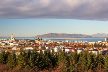 Panoramic view over downtown Reykjavik, Iceland, from the Perlan museum with low hanging clouds above